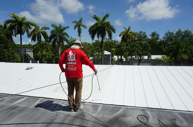Painter working on a roof
