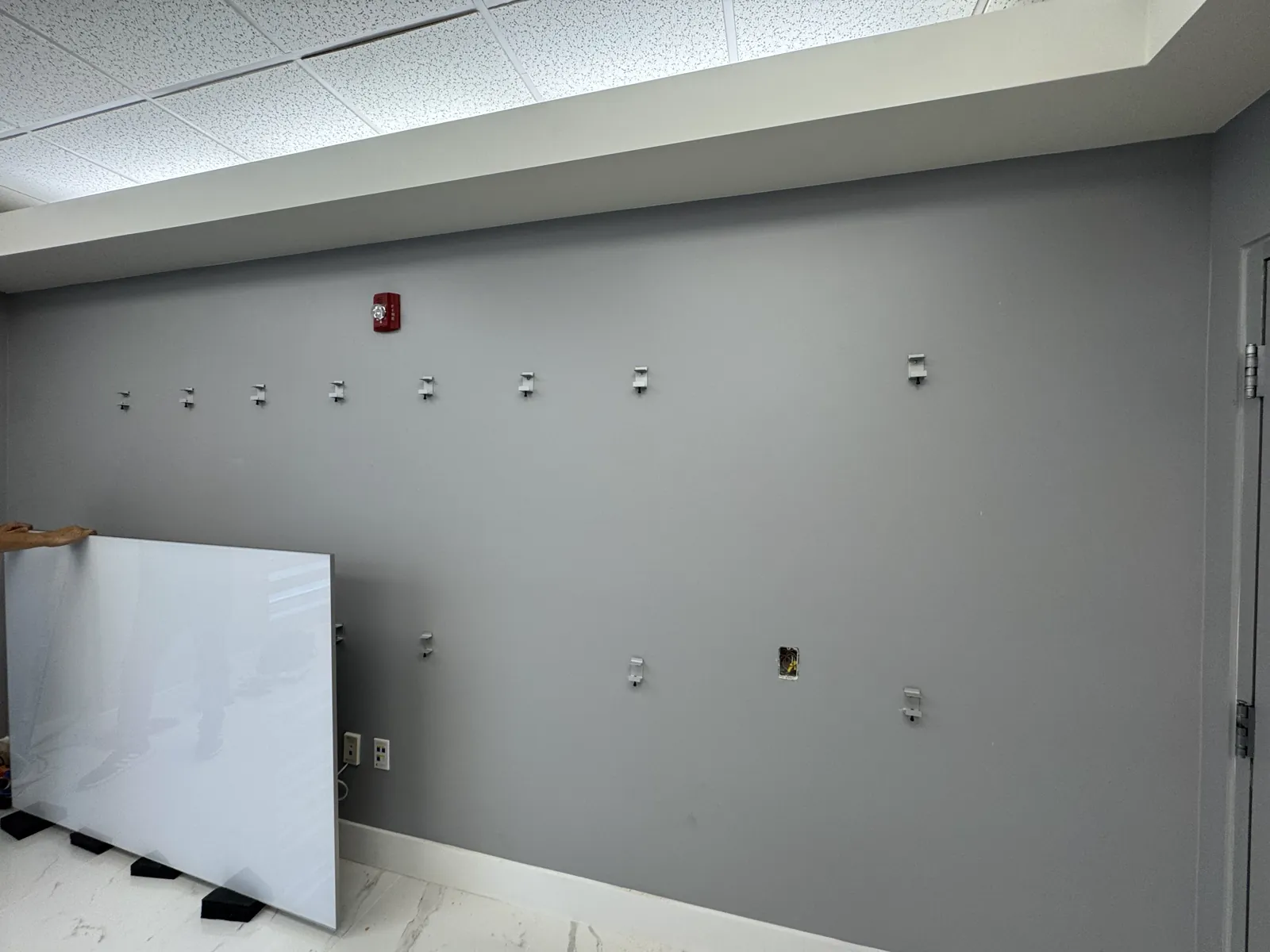 Wall prepared for professional handyman fixture installation